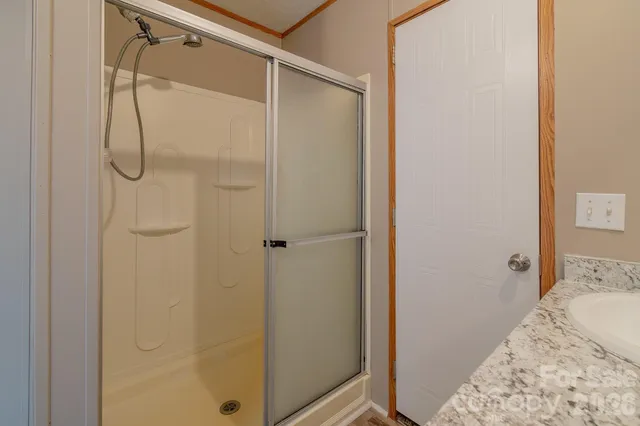 a bathroom with a sink toilet and a mirror