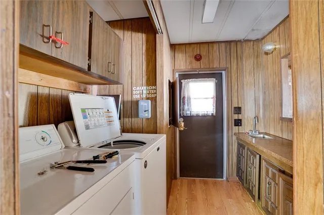 a kitchen with a refrigerator a stove and a window