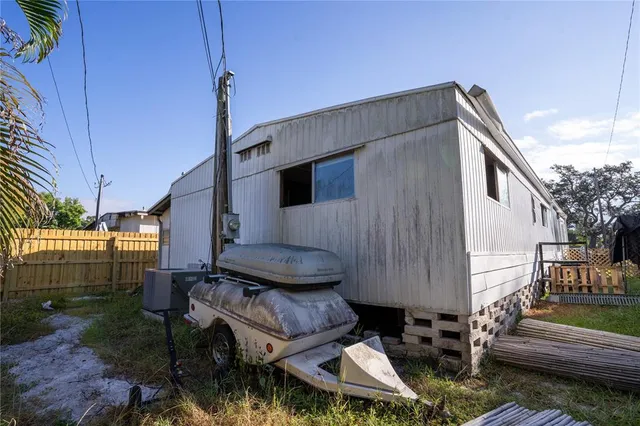 a backyard of a house with outdoor seating