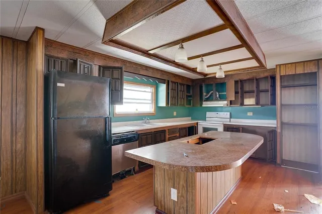 a table and chairs in a room next to a window