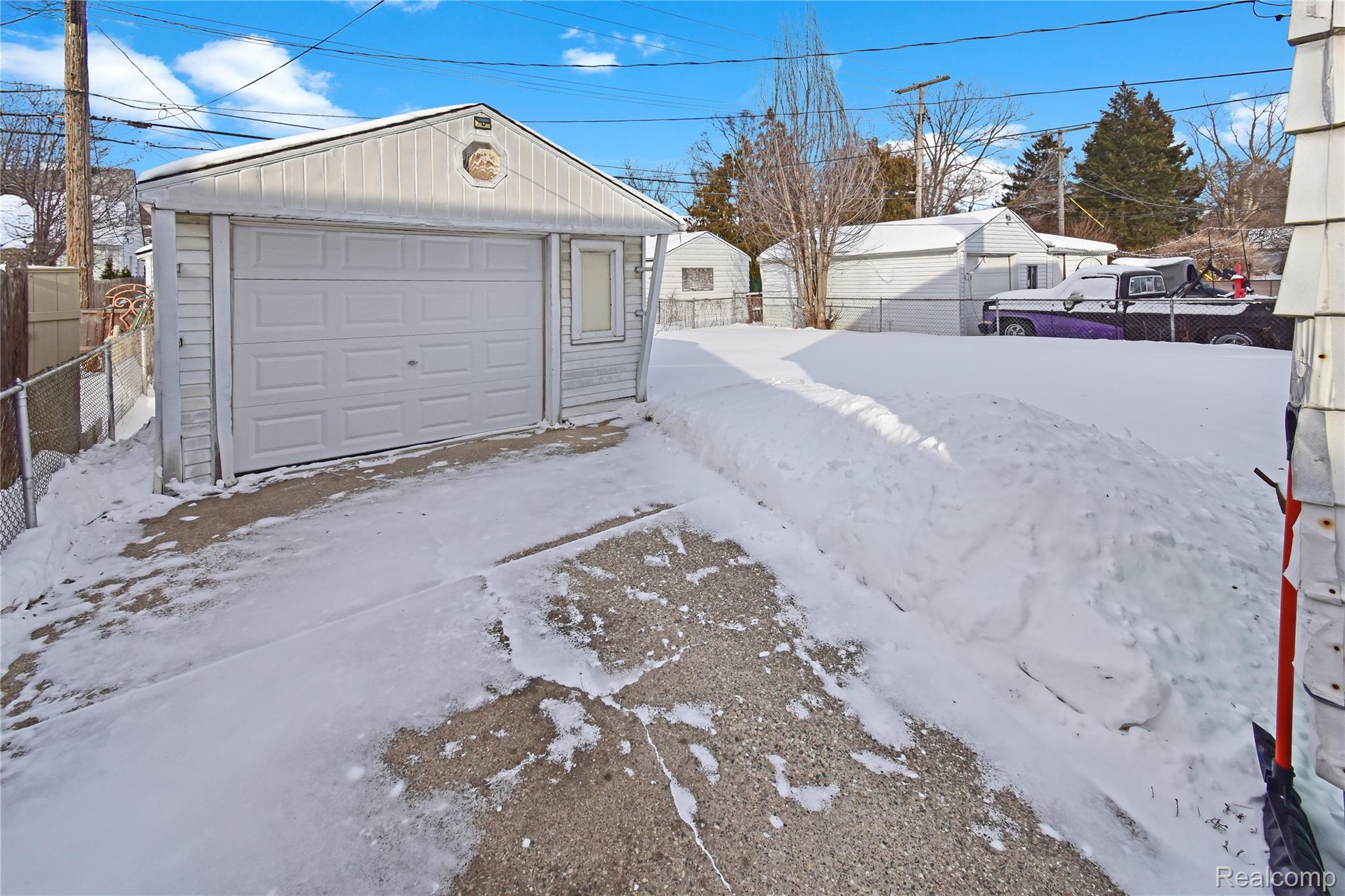 8305 Stephens Road Center Line, MI 48015 - Photo 23 of 23 Snow covered garage featuring a detached garage