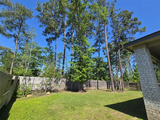 a view of a backyard of the house
