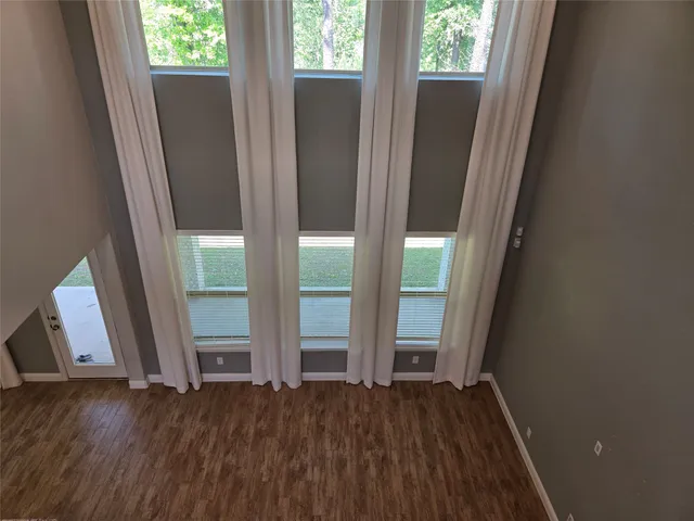 a view of front door with wooden floor