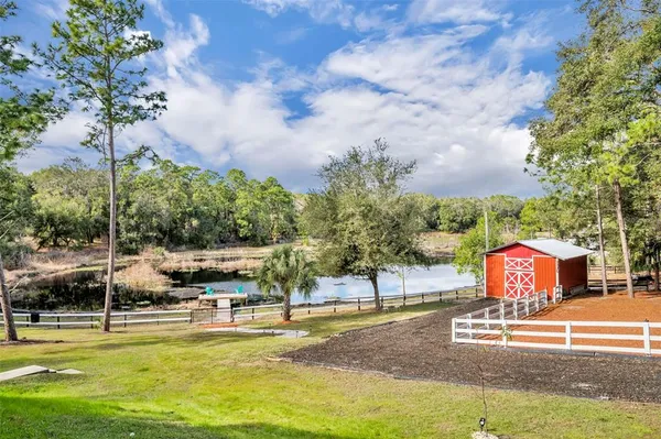 a view of a swimming pool with a patio