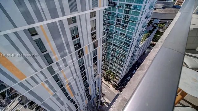 a view of a building with glass door and porch