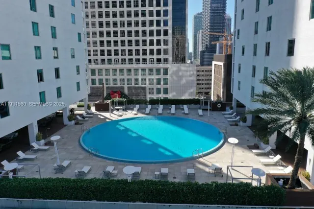 a front view of building with outdoor space and seating area