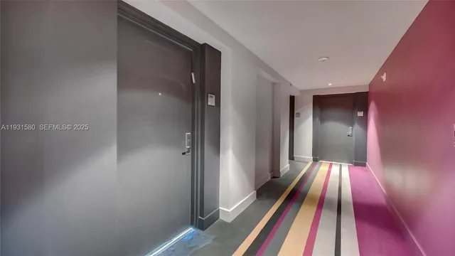 a living room with furniture and a hard wood floor