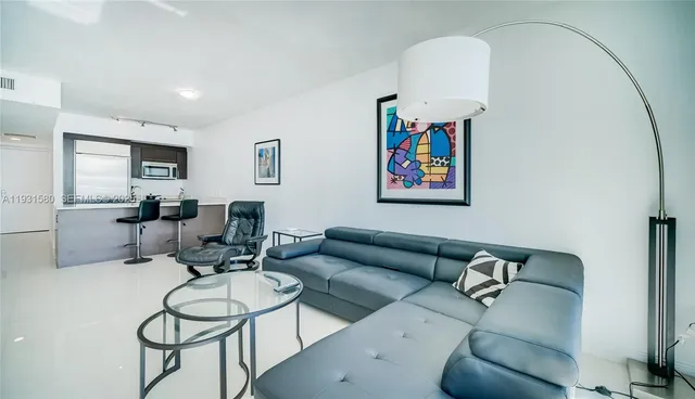 a kitchen with a sink and stainless steel appliances