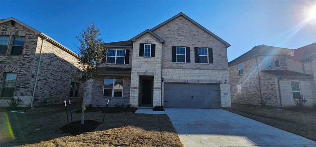 309 Breeds Hl Road Little Elm, TX 75068 - Photo 1 of 27 a front view of a house with a garden