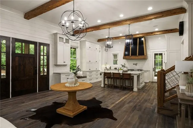 a kitchen with stainless steel appliances granite countertop a sink and stove