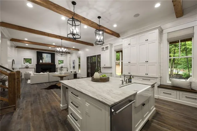 a spacious bathroom with a double vanity sink a mirror and a shower