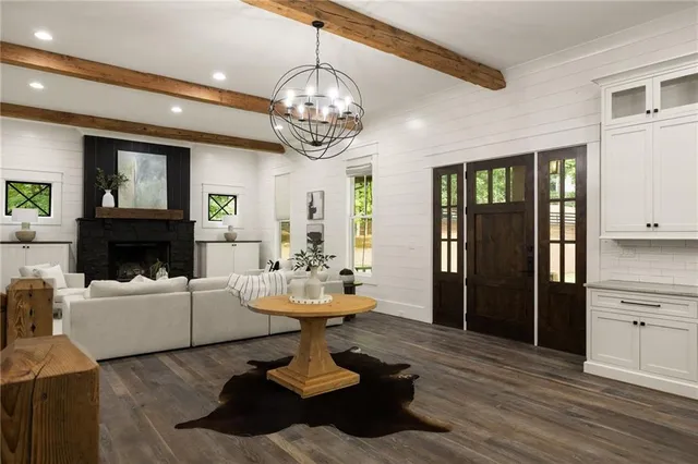 a kitchen with stainless steel appliances a stove a sink a oven a counter top space and a window