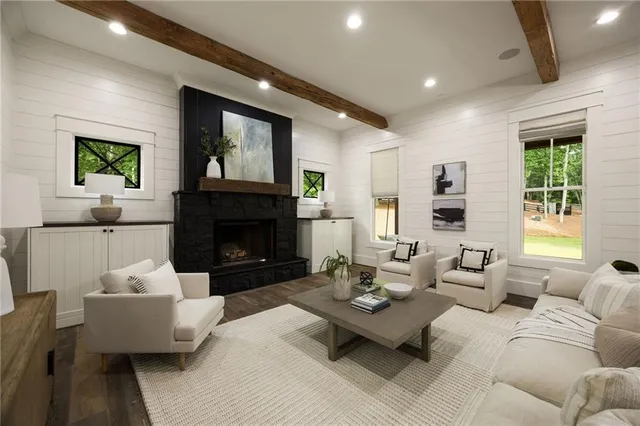 a living room with furniture and a chandelier