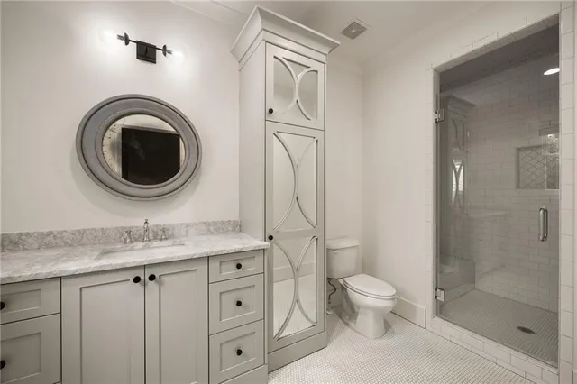 an aerial view of residential houses with outdoor space and trees