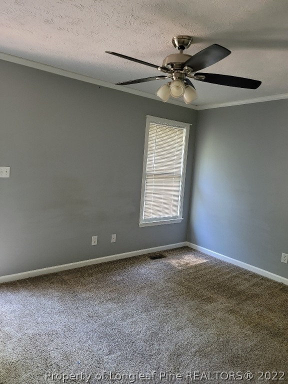 5042 Summer Ridge Road Fayetteville, NC 28303 - Photo 12 of 17 an empty room with windows and fan