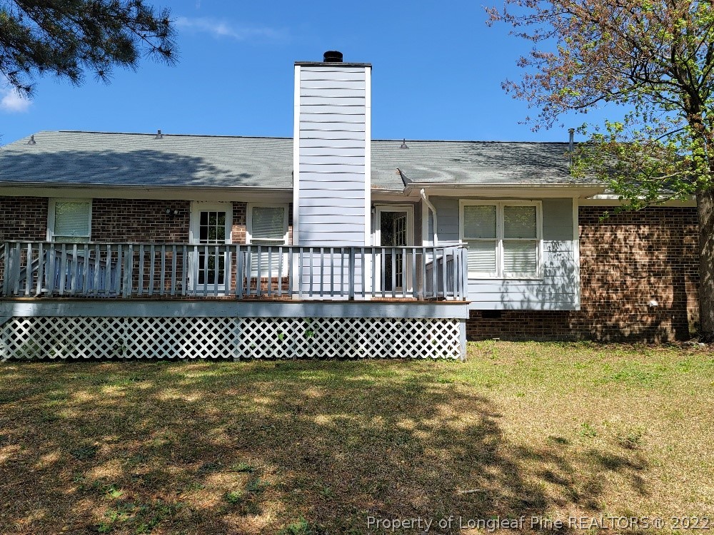 5042 Summer Ridge Road Fayetteville, NC 28303 - Photo 17 of 17 a front view of a house with a garden