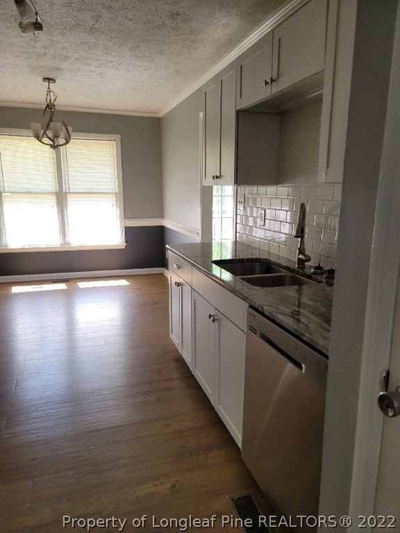 5042 Summer Ridge Road Fayetteville, NC 28303 - Photo 4 of 17 a kitchen with granite countertop a sink and a stove top oven