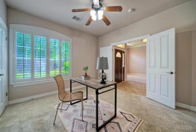 a view of a dining room with furniture window and chandelier