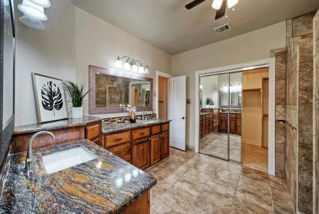 a large bathroom with a tub and sink