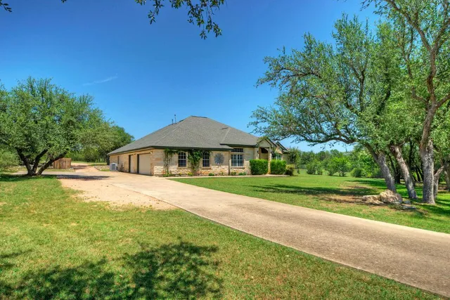 a front view of a house with yard