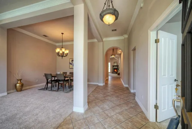 a view of a room with a table and chairs