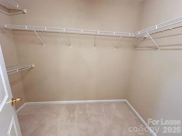 a view of a room with racks on the wall