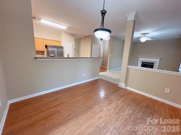 a view of a livingroom with wooden floor