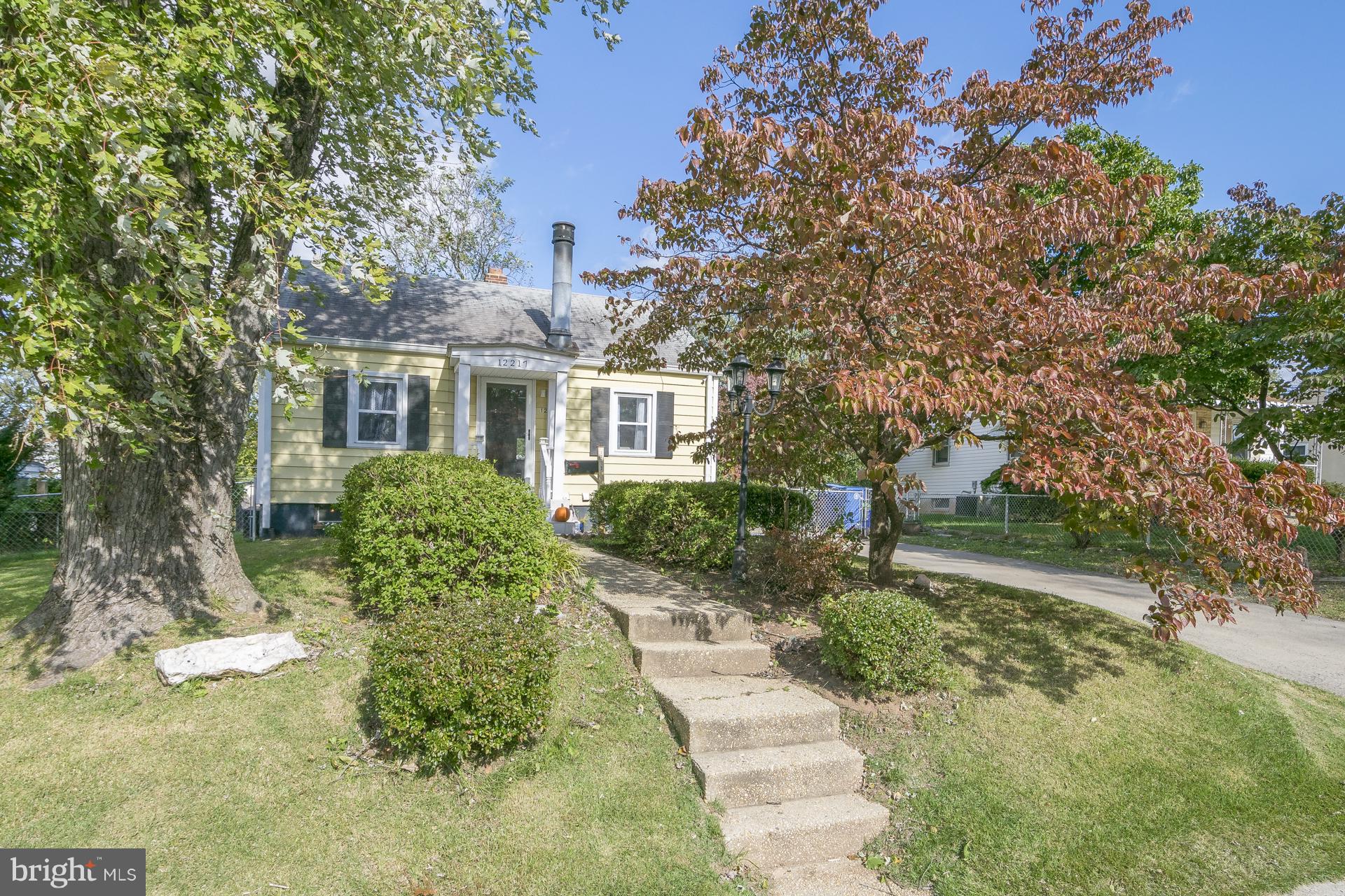 12217 Charles Road Silver Spring, MD 20906 - Photo 1 of 30 a front view of a house with a yard