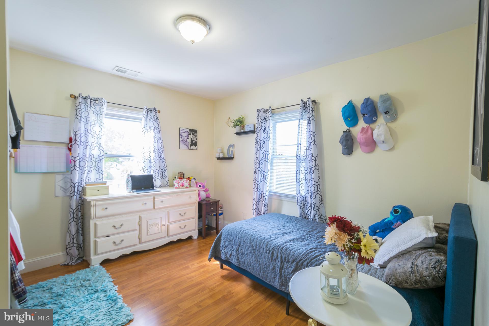 12217 Charles Road Silver Spring, MD 20906 - Photo 13 of 30 a bedroom with a bed and a couch