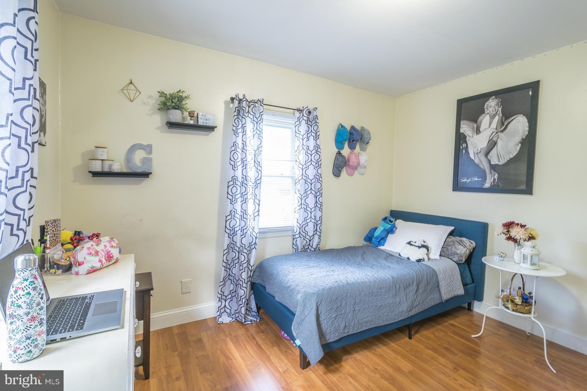 12217 Charles Road Silver Spring, MD 20906 - Photo 14 of 30 a bedroom with a bed and a window