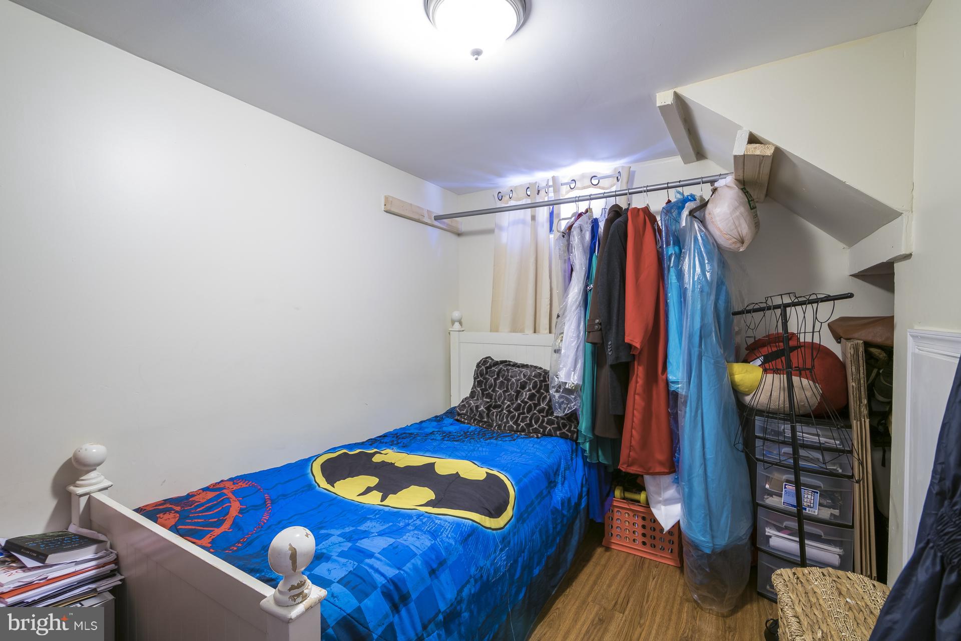 12217 Charles Road Silver Spring, MD 20906 - Photo 21 of 30 a bedroom with a bed and a closet