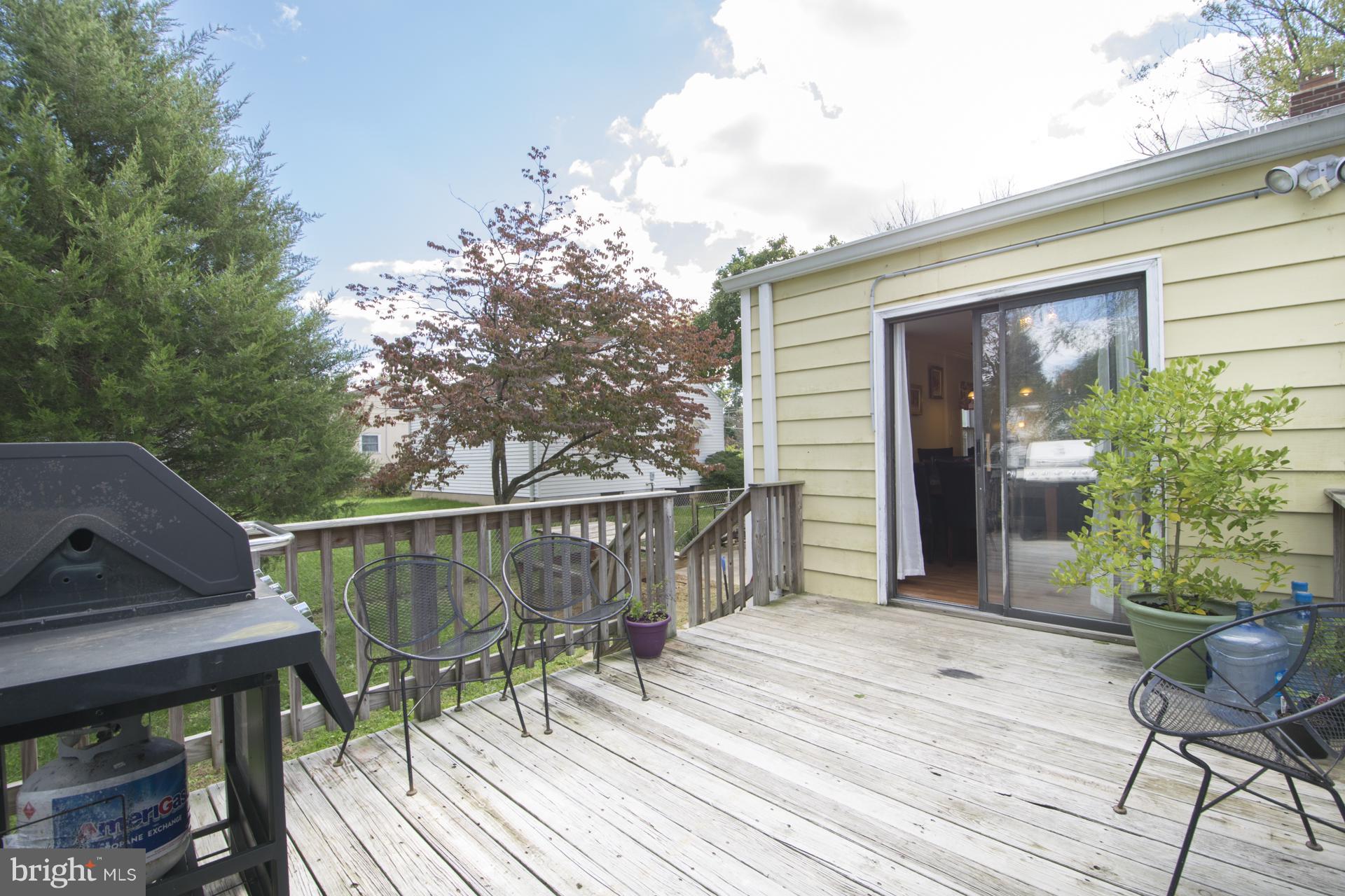 12217 Charles Road Silver Spring, MD 20906 - Photo 29 of 30 a balcony with wooden floor table and chairs