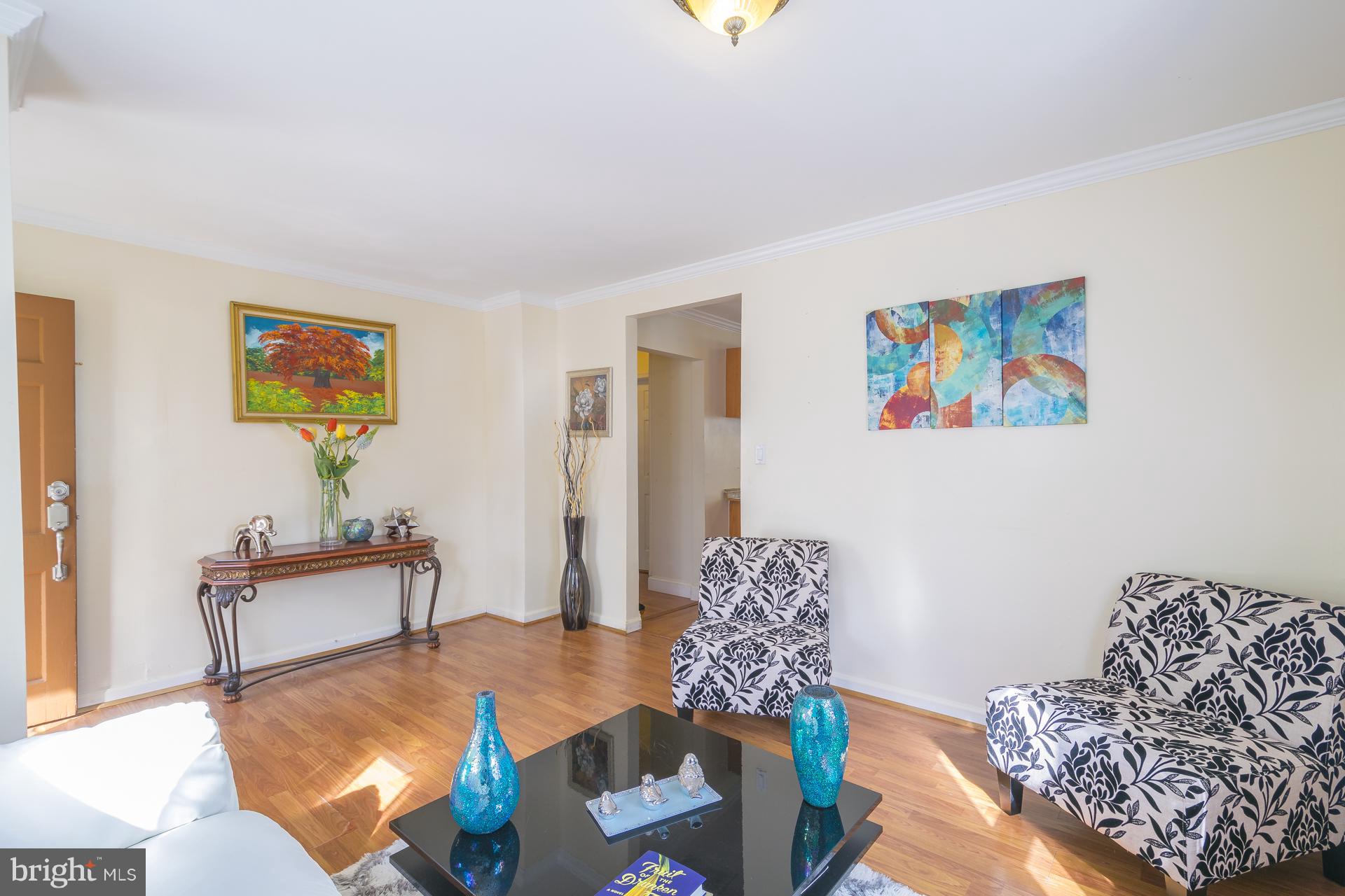 12217 Charles Road Silver Spring, MD 20906 - Photo 6 of 30 a living room with furniture and wooden floor