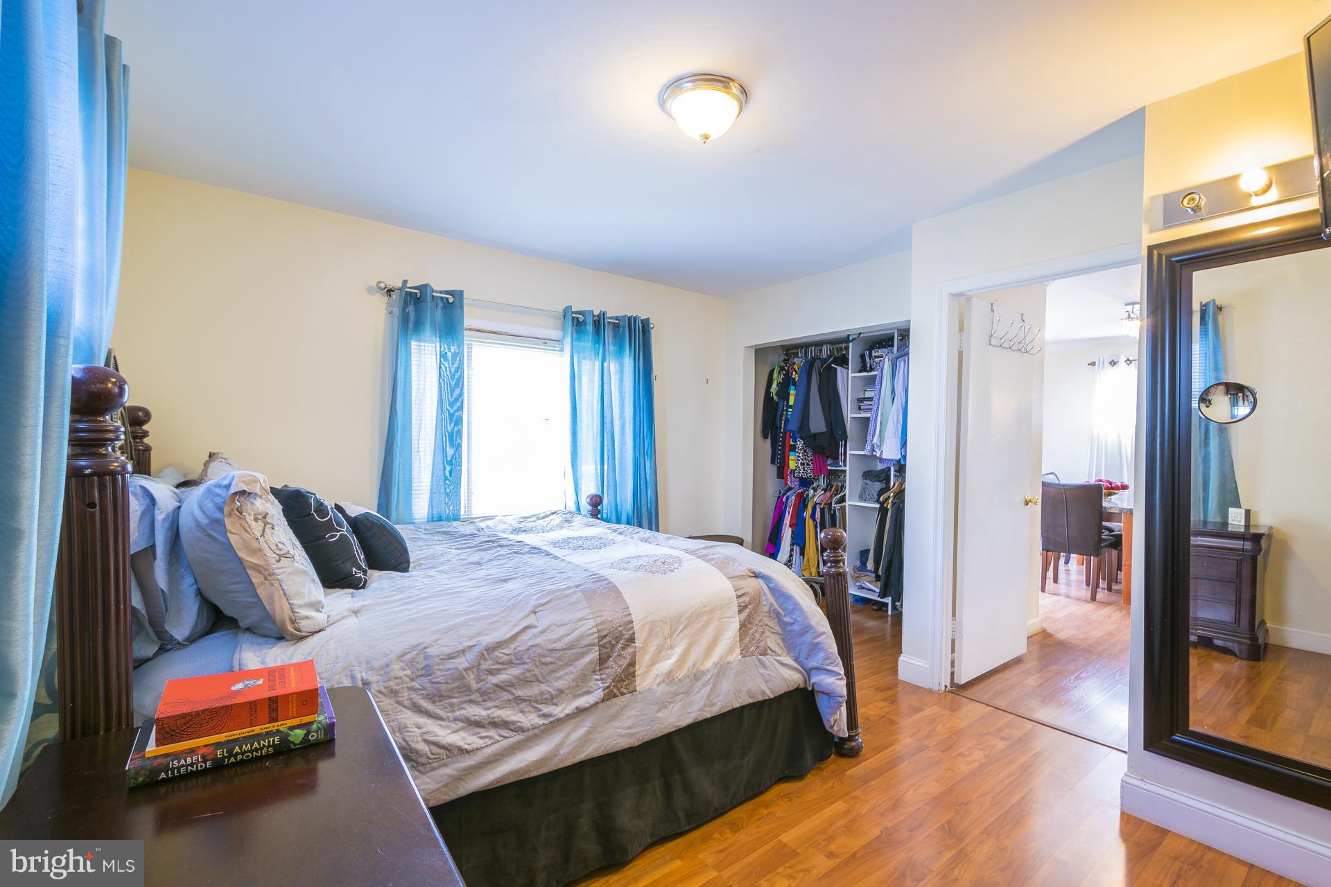 12217 Charles Road Silver Spring, MD 20906 - Photo 10 of 30 a bedroom with a bed and a window