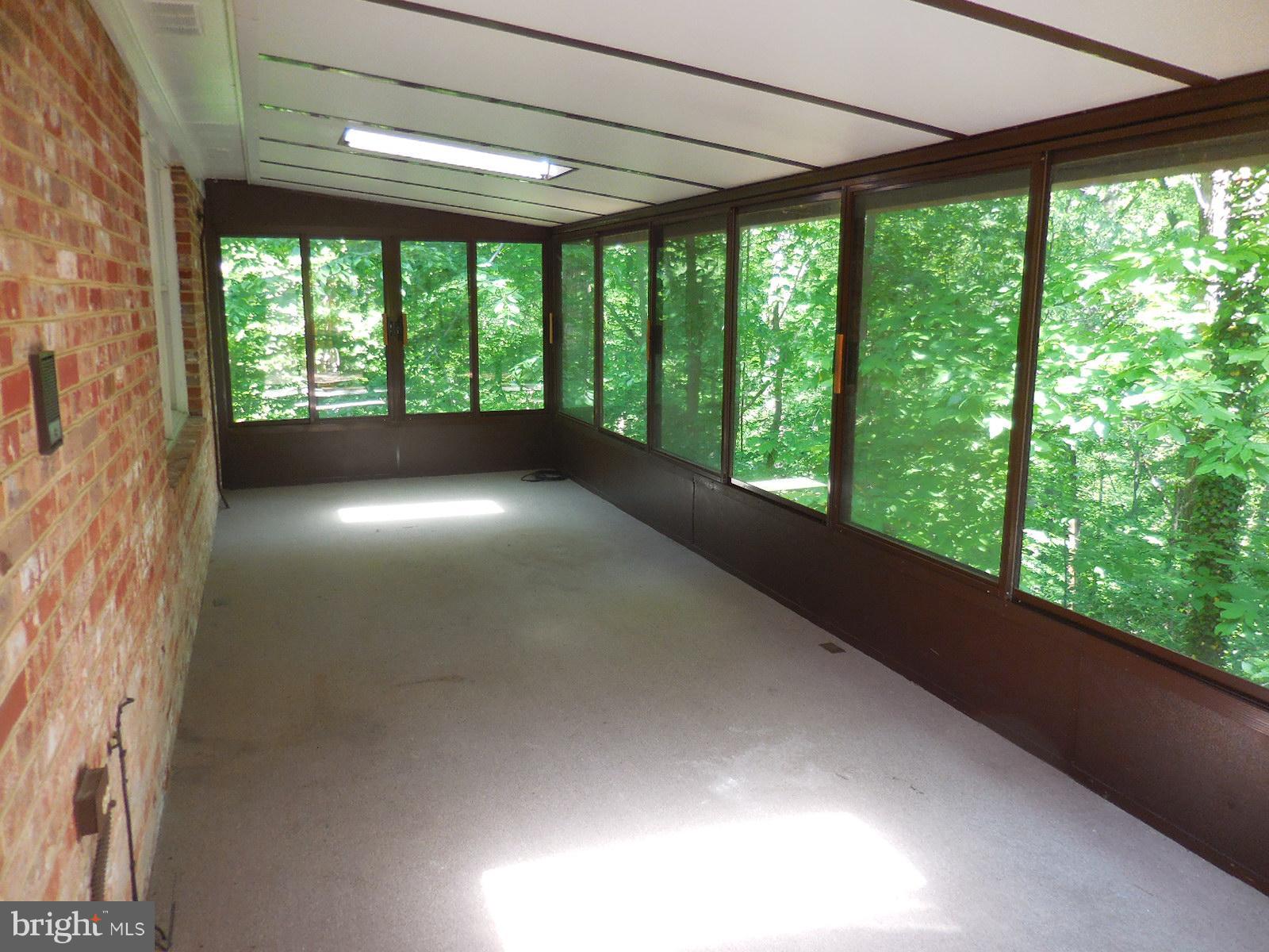508 Holly Road Fort Washington, MD 20744 - Photo 25 of 29 a view of empty room with large windows and city view
