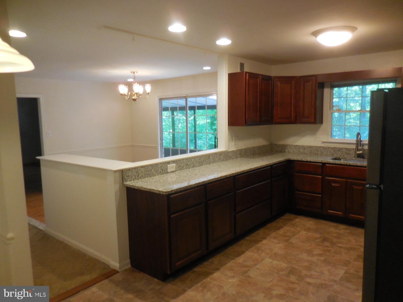 508 Holly Road Fort Washington, MD 20744 - Photo 4 of 29 a kitchen with a sink and a window