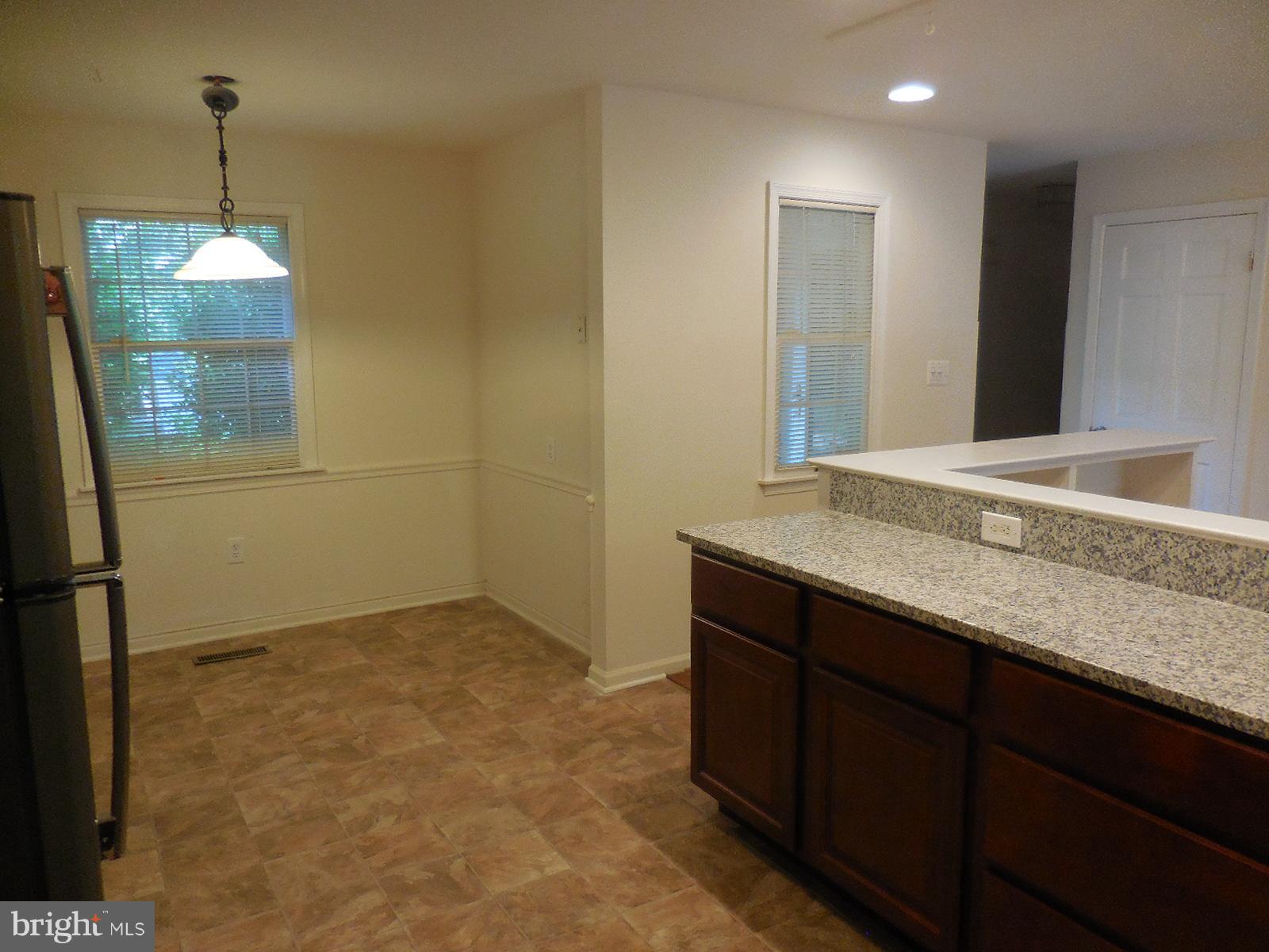 508 Holly Road Fort Washington, MD 20744 - Photo 6 of 29 a bathroom with a granite countertop sink and a mirror