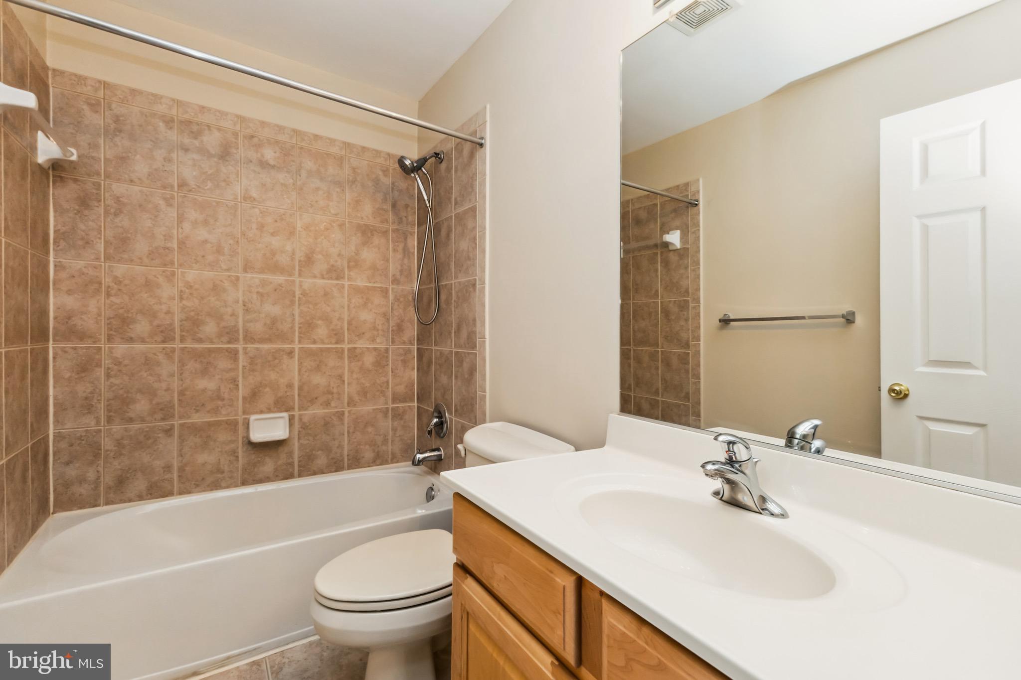49 Inkberry Circle Gaithersburg, MD 20877 - Photo 11 of 25 a bathroom with a sink a toilet and shower