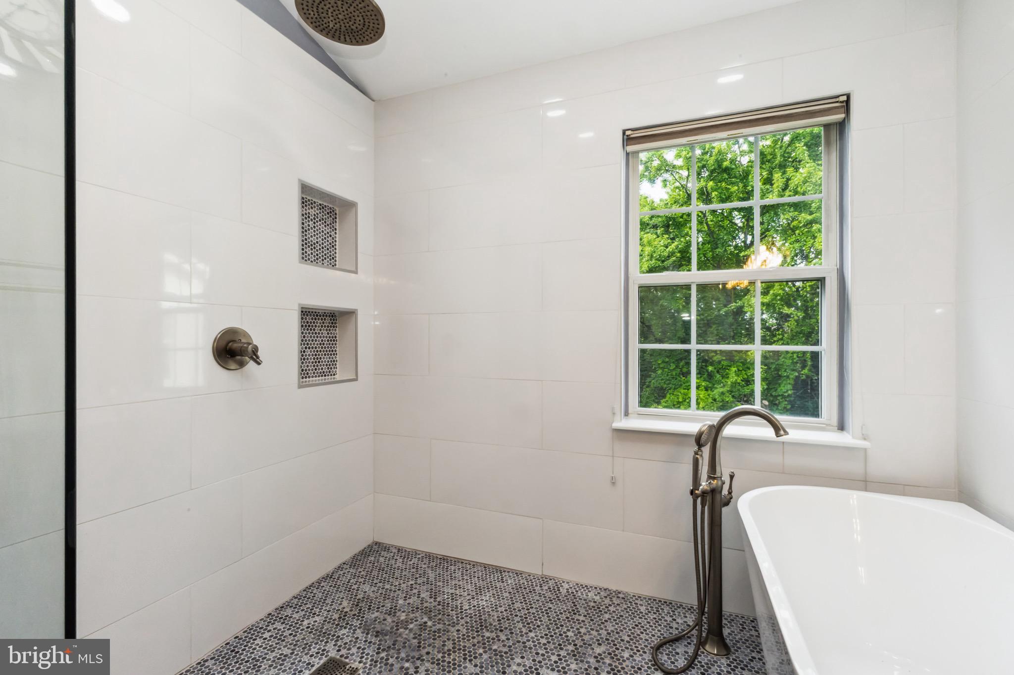 49 Inkberry Circle Gaithersburg, MD 20877 - Photo 19 of 25 a bathroom with a tub sink and window