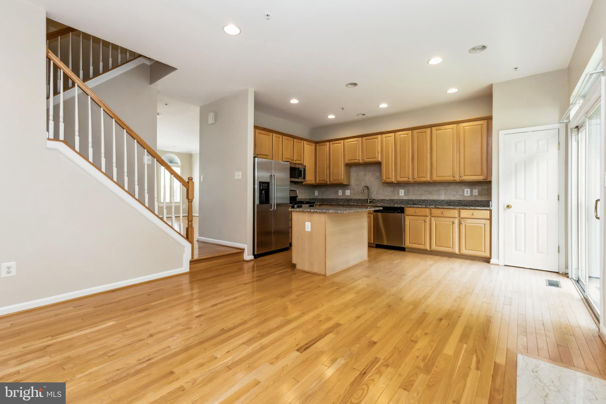 49 Inkberry Circle Gaithersburg, MD 20877 - Photo 7 of 25 a view of kitchen with wooden floor electronic appliances and window