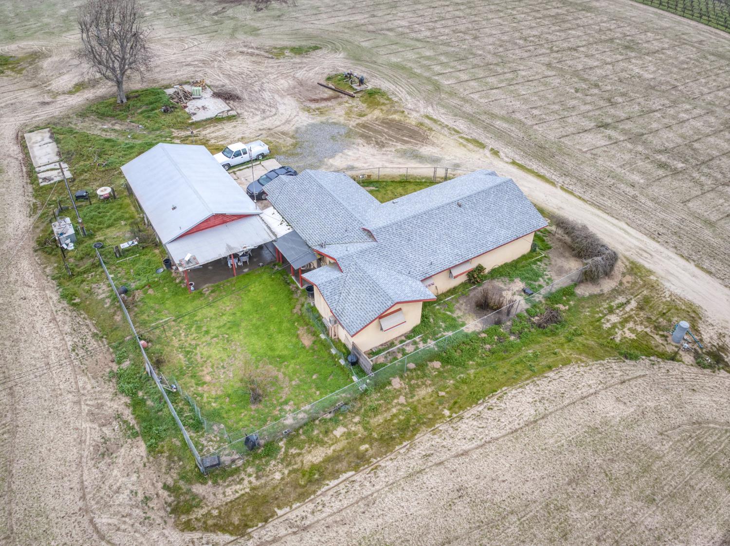 13370 South Bryan Avenue Caruthers, CA 93609 - Photo 16 of 28 an aerial view of a house with garden space and street view