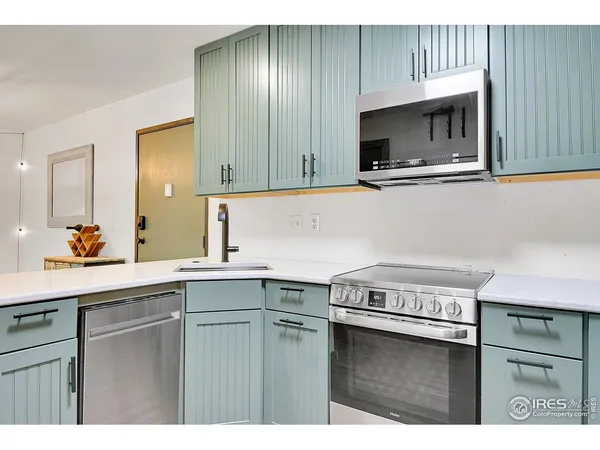 a kitchen with a sink and a microwave