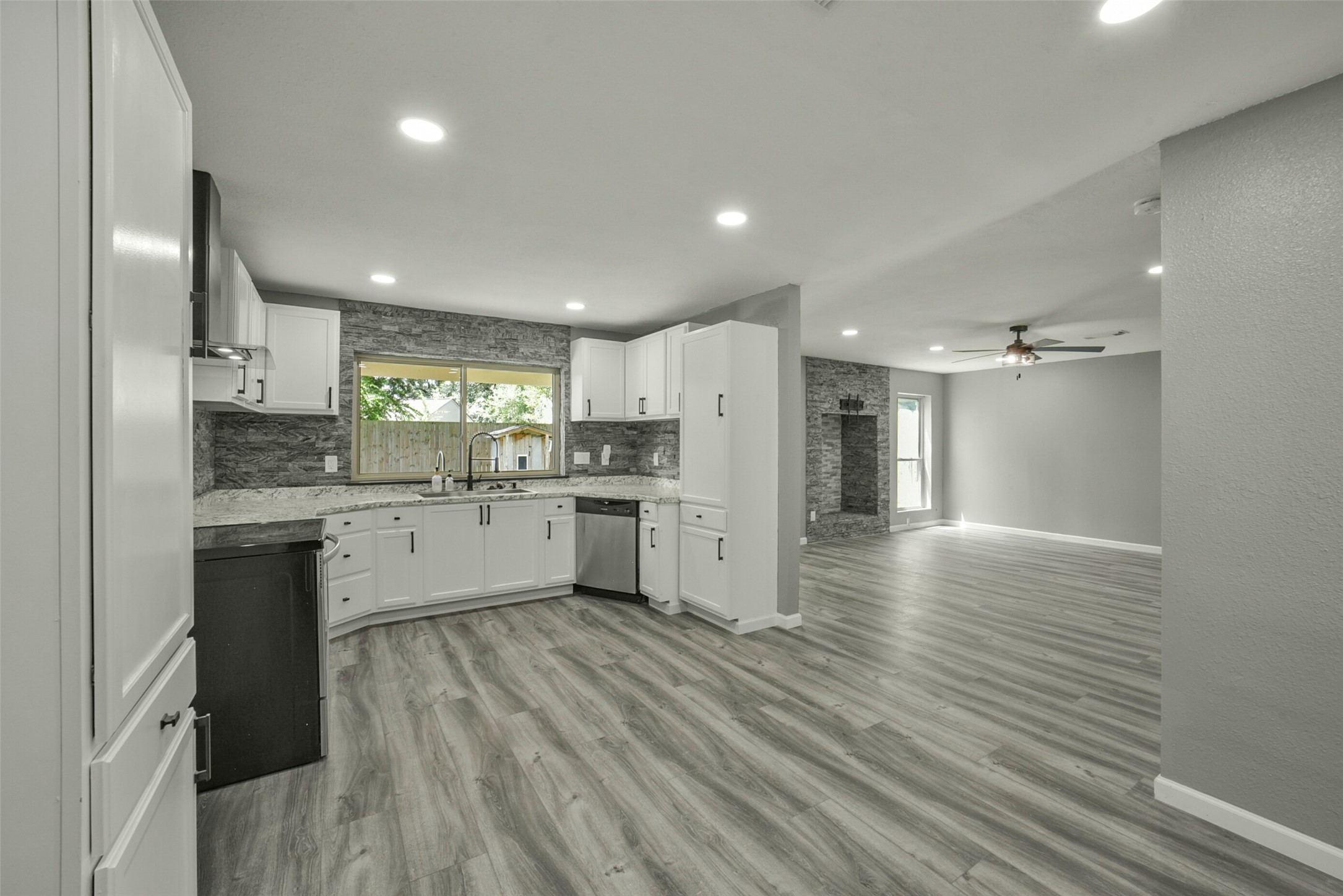 18606 Mellowgrove Lane Spring, TX 77379 - Photo 8 of 43 Beautiful kitchen is adjacent to the open living room