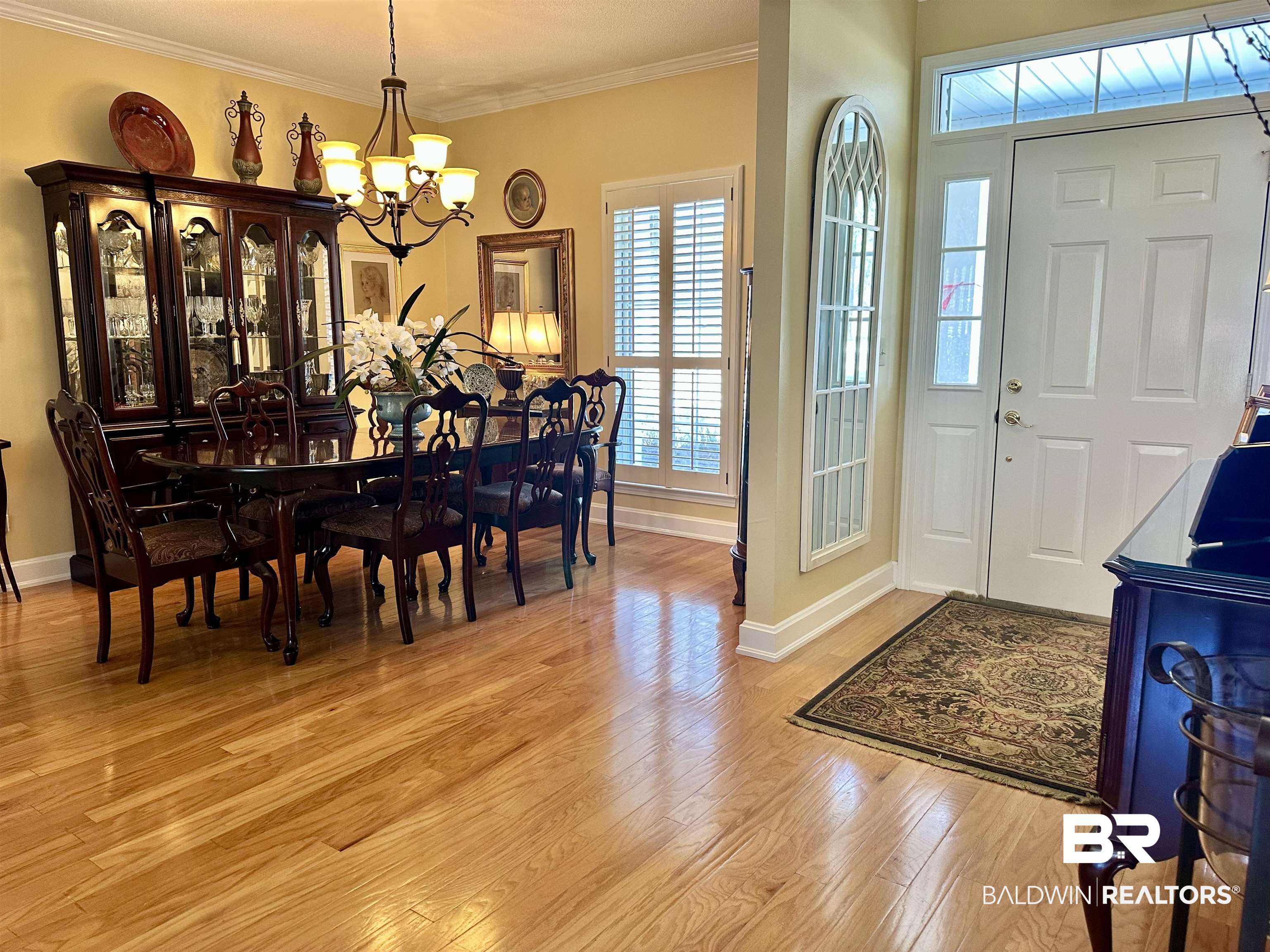 148 Brooks Boulevard Brewton, AL 36426 - Photo 3 of 45 Foyer featuring ornamental molding, light wood-style floors, baseboards, and a chandelier