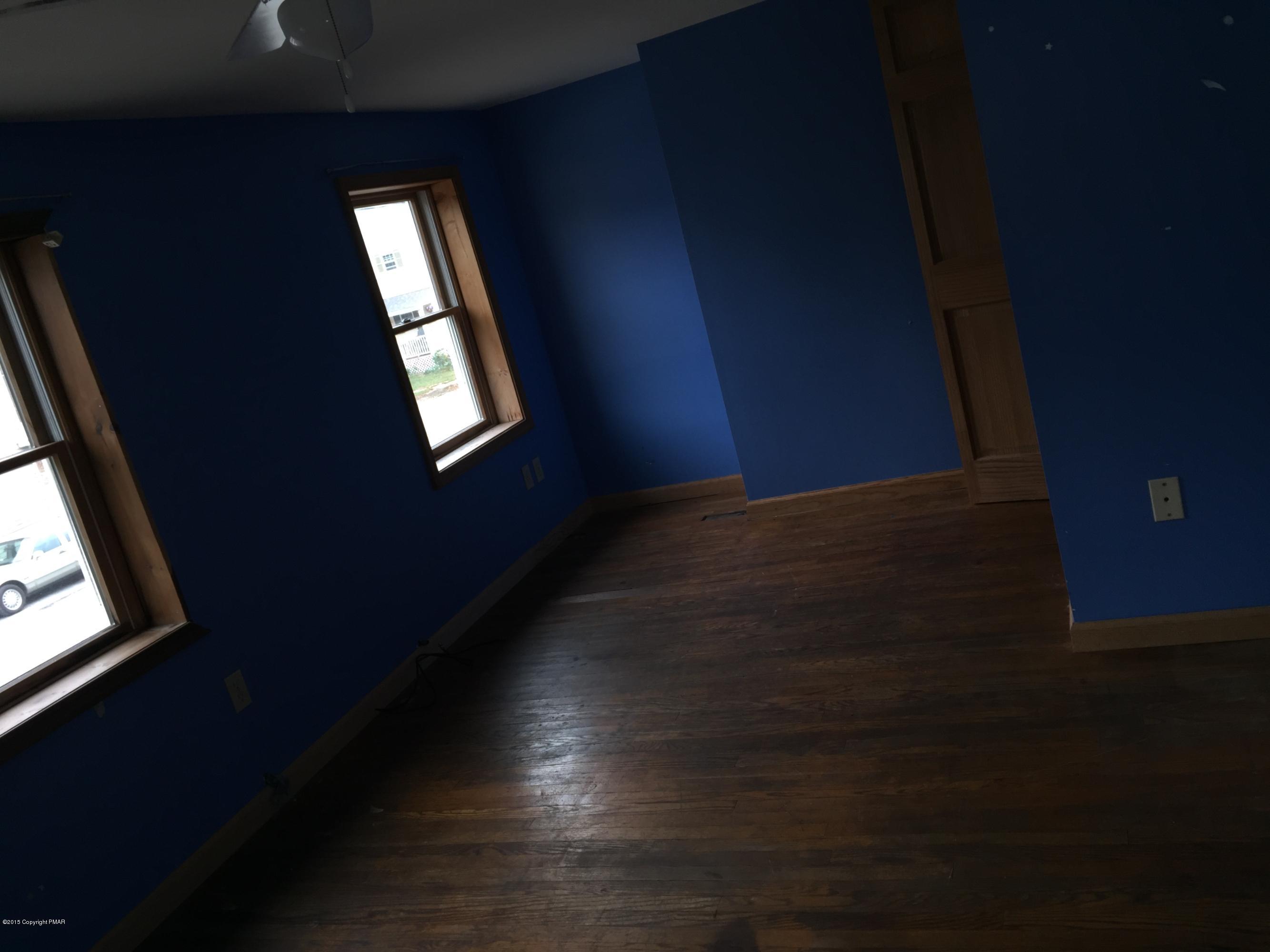 214 Keystone Street Hawley, PA 18428 - Photo 2 of 8 a view of an empty room and window