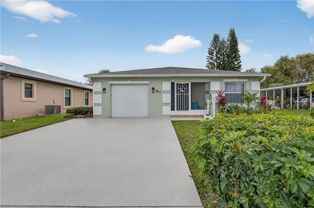 14339 Amapola Circle Fort Pierce, FL 34951 - Photo 1 of 36 a front view of house with yard and green space