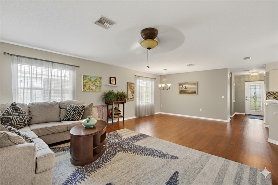 14339 Amapola Circle Fort Pierce, FL 34951 - Photo 11 of 36 a living room with furniture and a large window