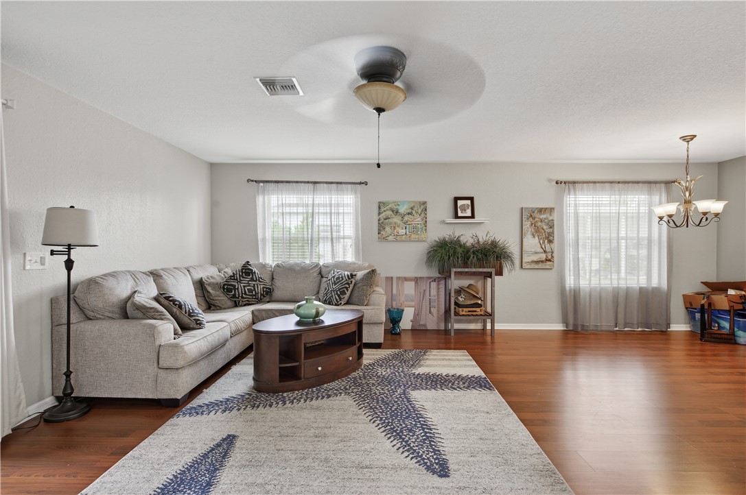 14339 Amapola Circle Fort Pierce, FL 34951 - Photo 12 of 36 a living room with furniture and a wooden floor