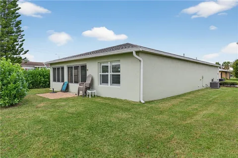 a front view of a house with a yard and porch