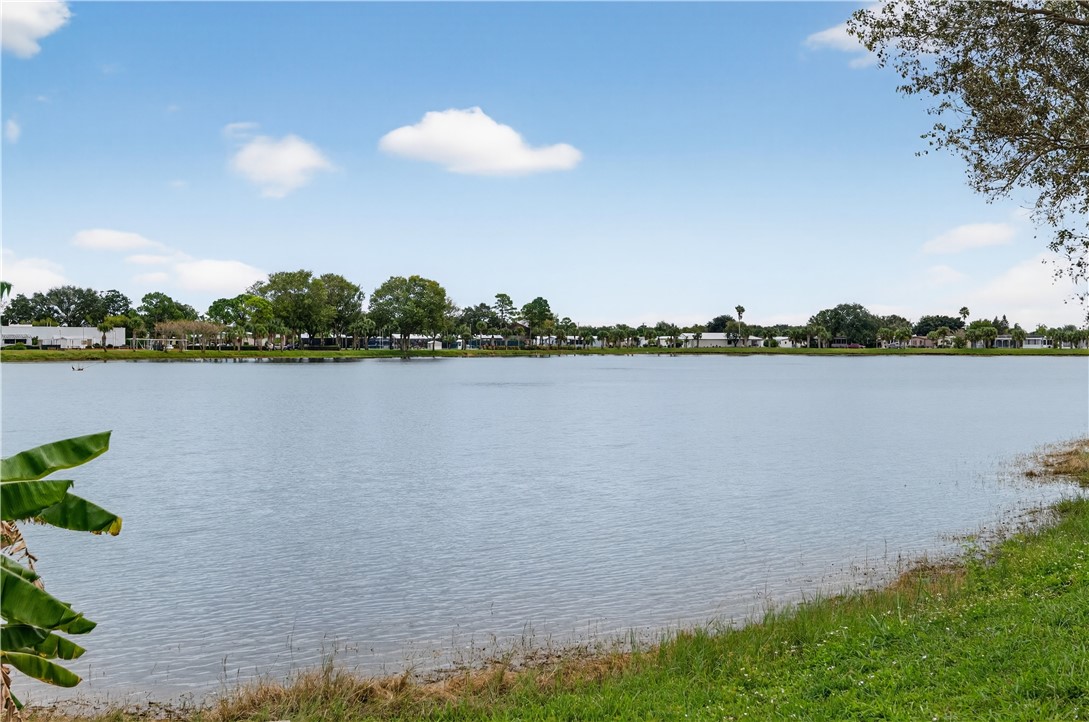 14339 Amapola Circle Fort Pierce, FL 34951 - Photo 25 of 36 a view of a lake with houses in the back